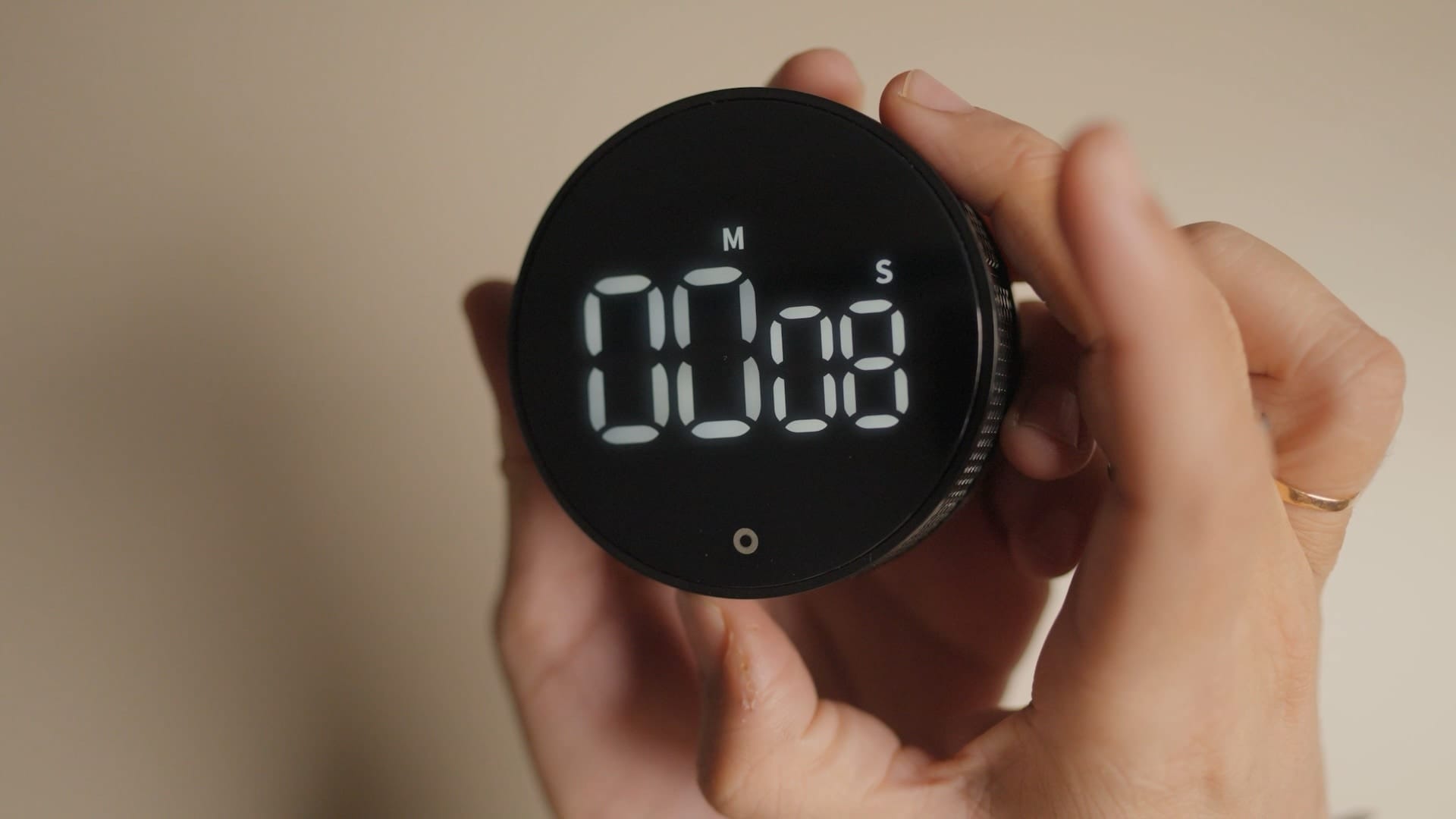 rotating the ring to set the time