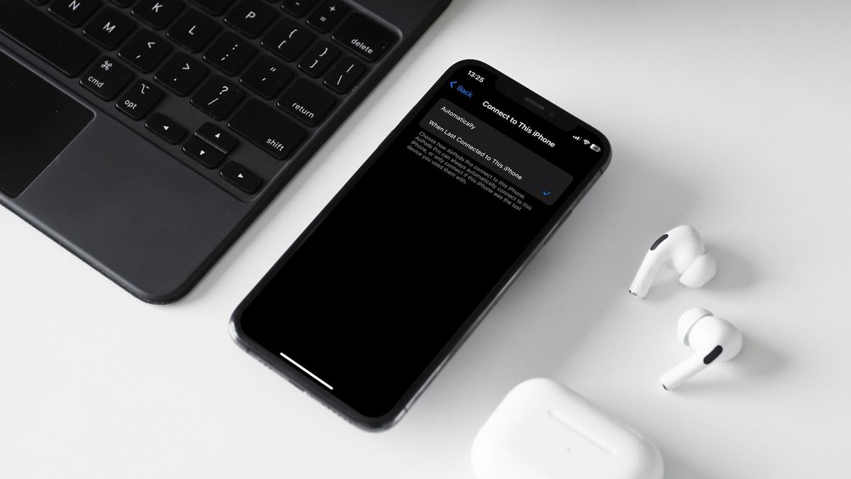 iPhone, AirPods Pro, and Magic Keyboard in fra