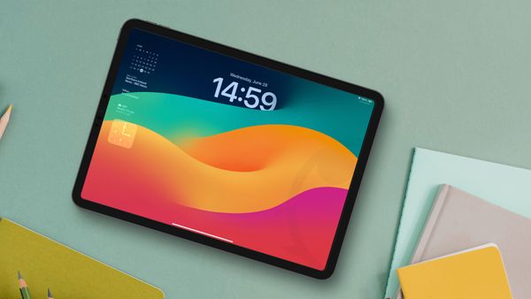 iPad pro on table showing lock screen widgets