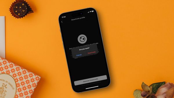 iPhone on table showing Threads deactivate account page
