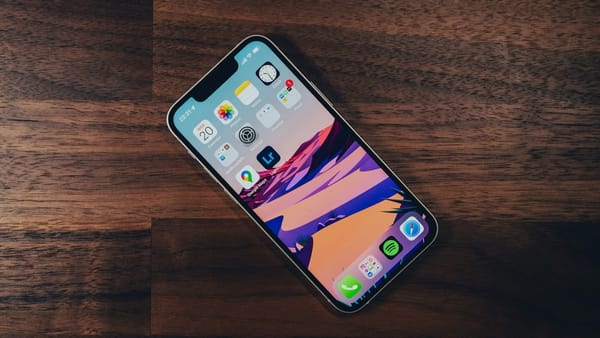 iPhone 13 mini on wooden table