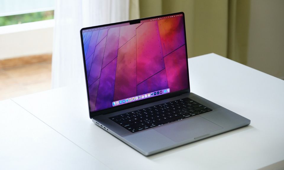 16-inc MacBook Pro on a white table with window as background