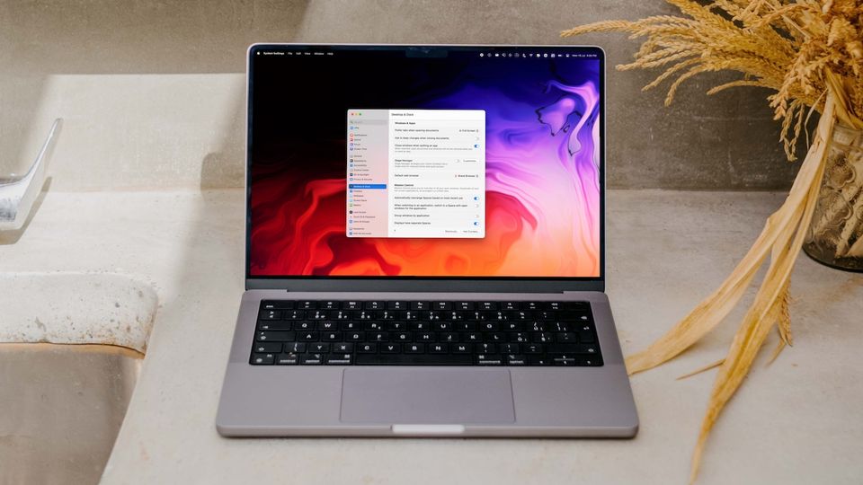 Apple MacBook Pro on on white slab showing default browser setting in macOS Ventura