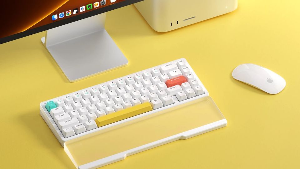 Wireless mechanical keyboard on table with Mac studio and Apple Magic Mouse