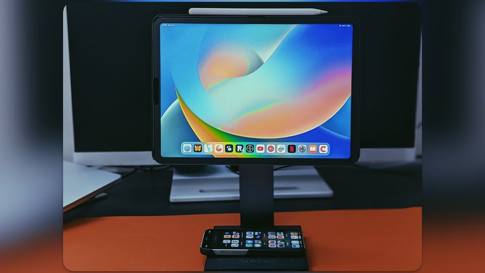 PITAKA MagEZ Charging Stand on desk with iPhone