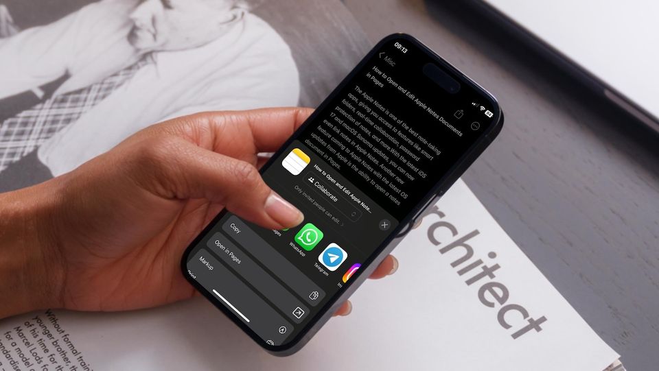 hand holding iPhone showing opening Notes as Pages documents